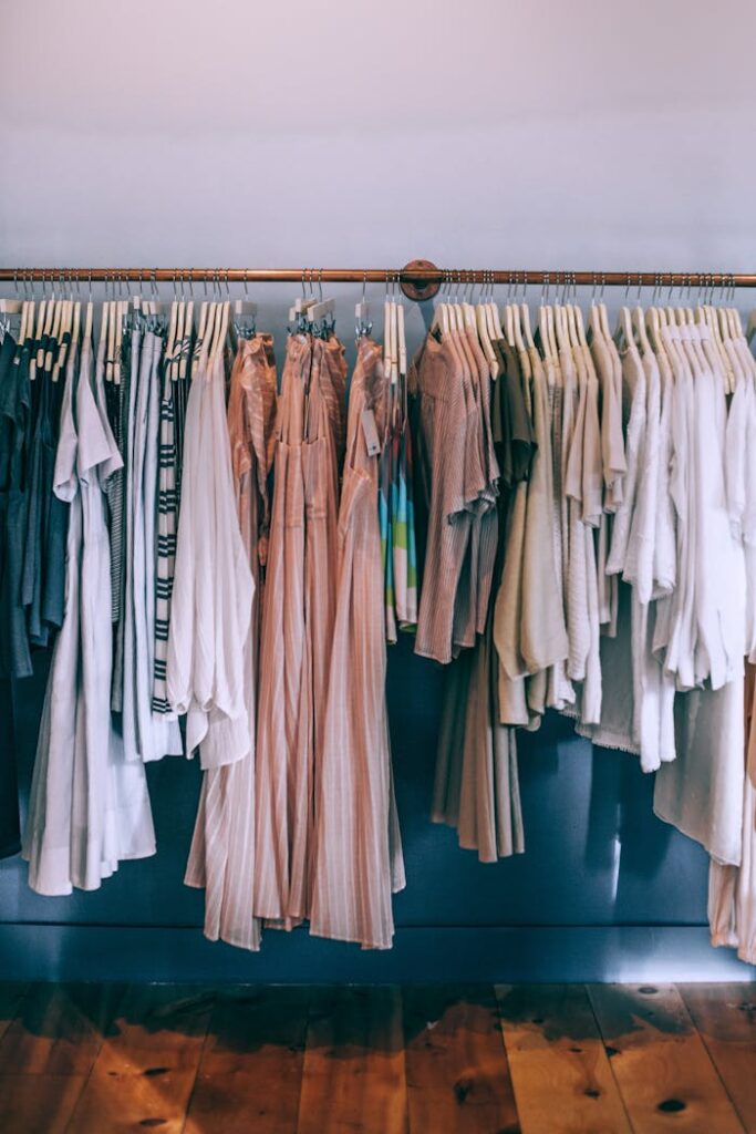 Collection of female clothes on rack in boutique