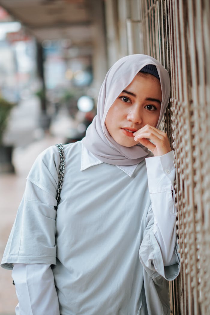 Asian gentle woman in hijab on urban street